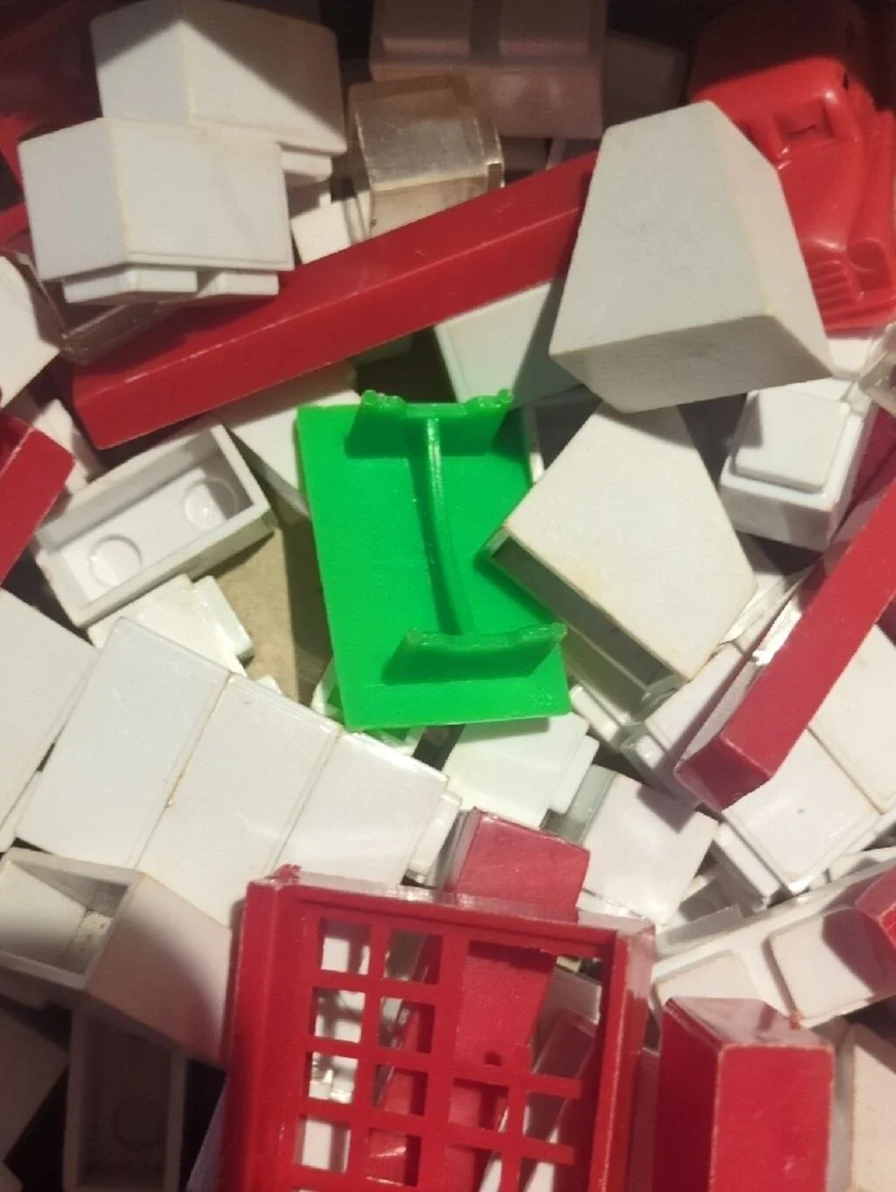 Assorted Kids Building Set Pieces in Red, White, Green, Orange